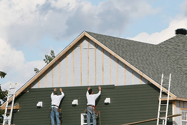 Professional Siding Installation technician working in Port Jefferson Station, NY